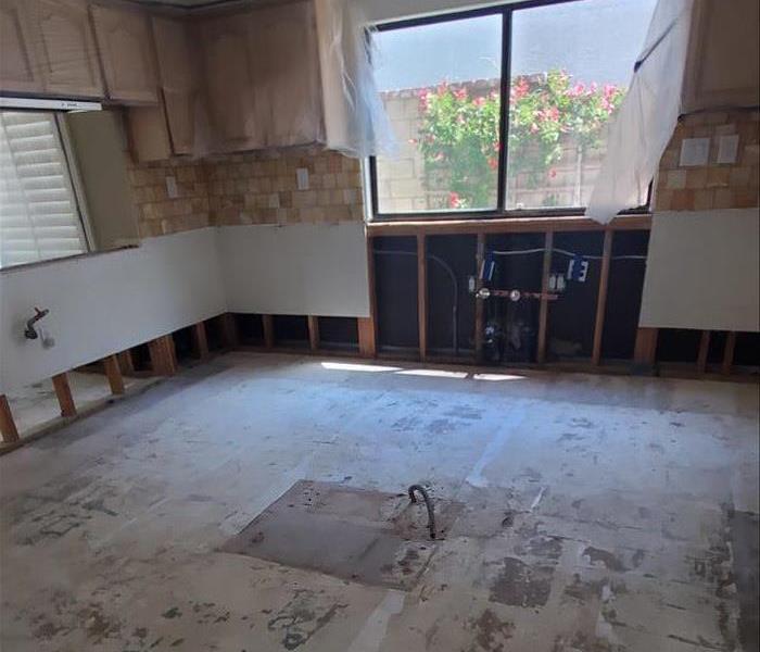 Affected lower cabinets, appliances and flooring were removed
